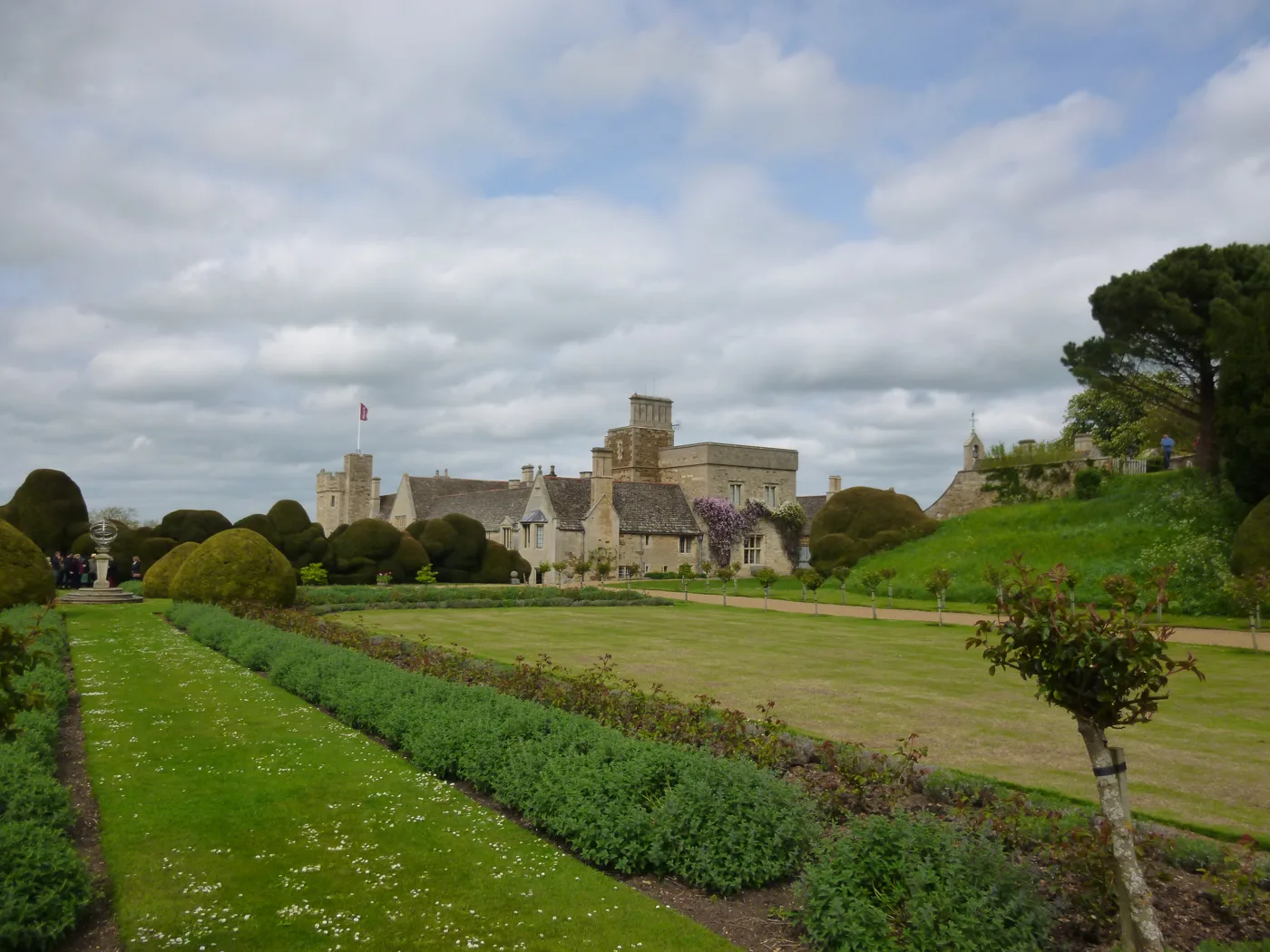 The formal garden at Rockingham Castle in summer. The castle's Christmas concert is in the Great Hall on 3 December 2026.
